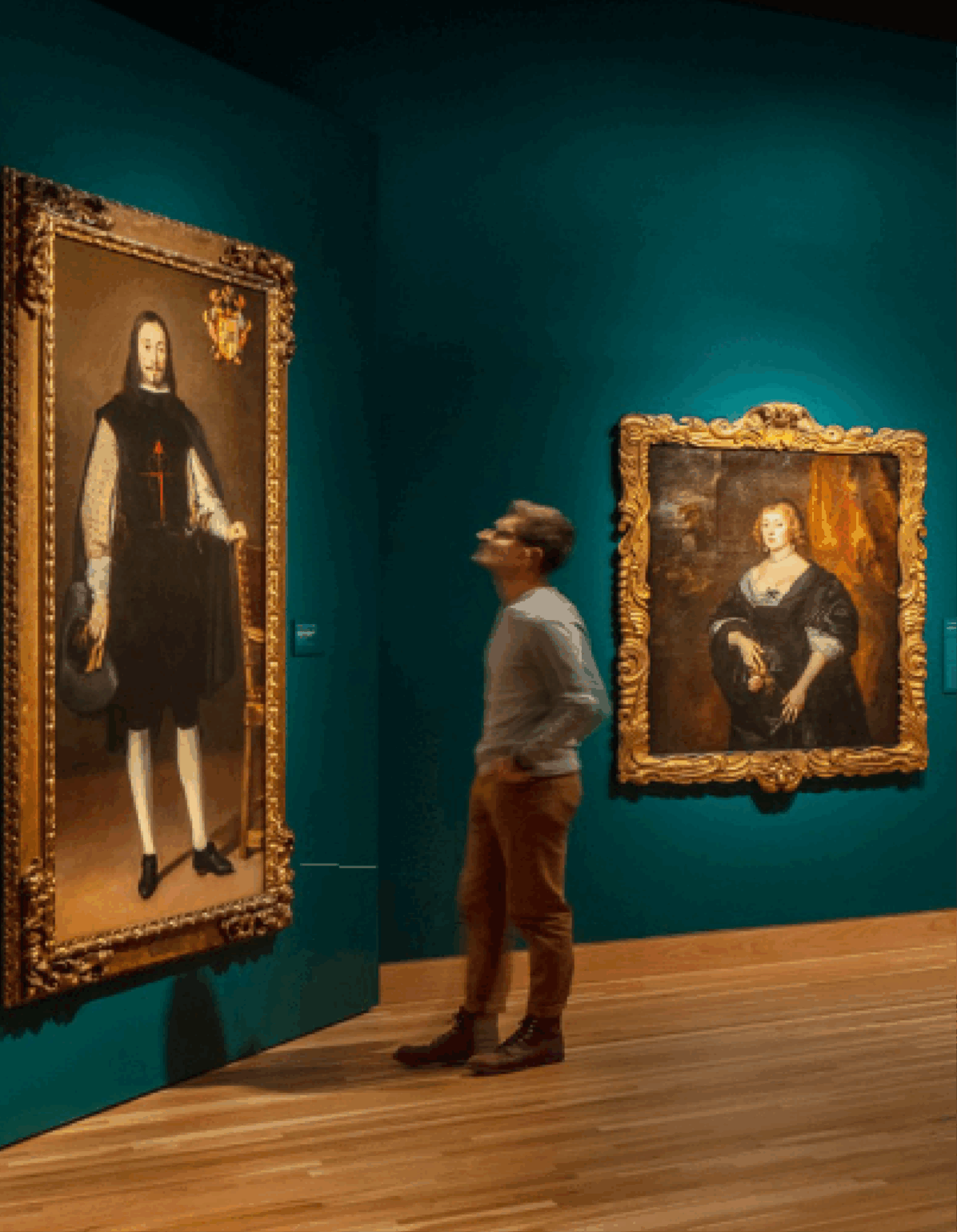 Museum visitor in a Denver Art Museum gallery looking at a painting