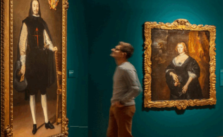 Museum visitor in a Denver Art Museum gallery looking at a painting